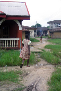 A mud street in Oloibiri, Nigeria. Credit: Jim Wallace, NPR.